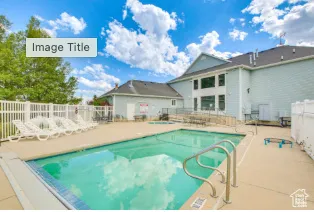 Community pool with a patio