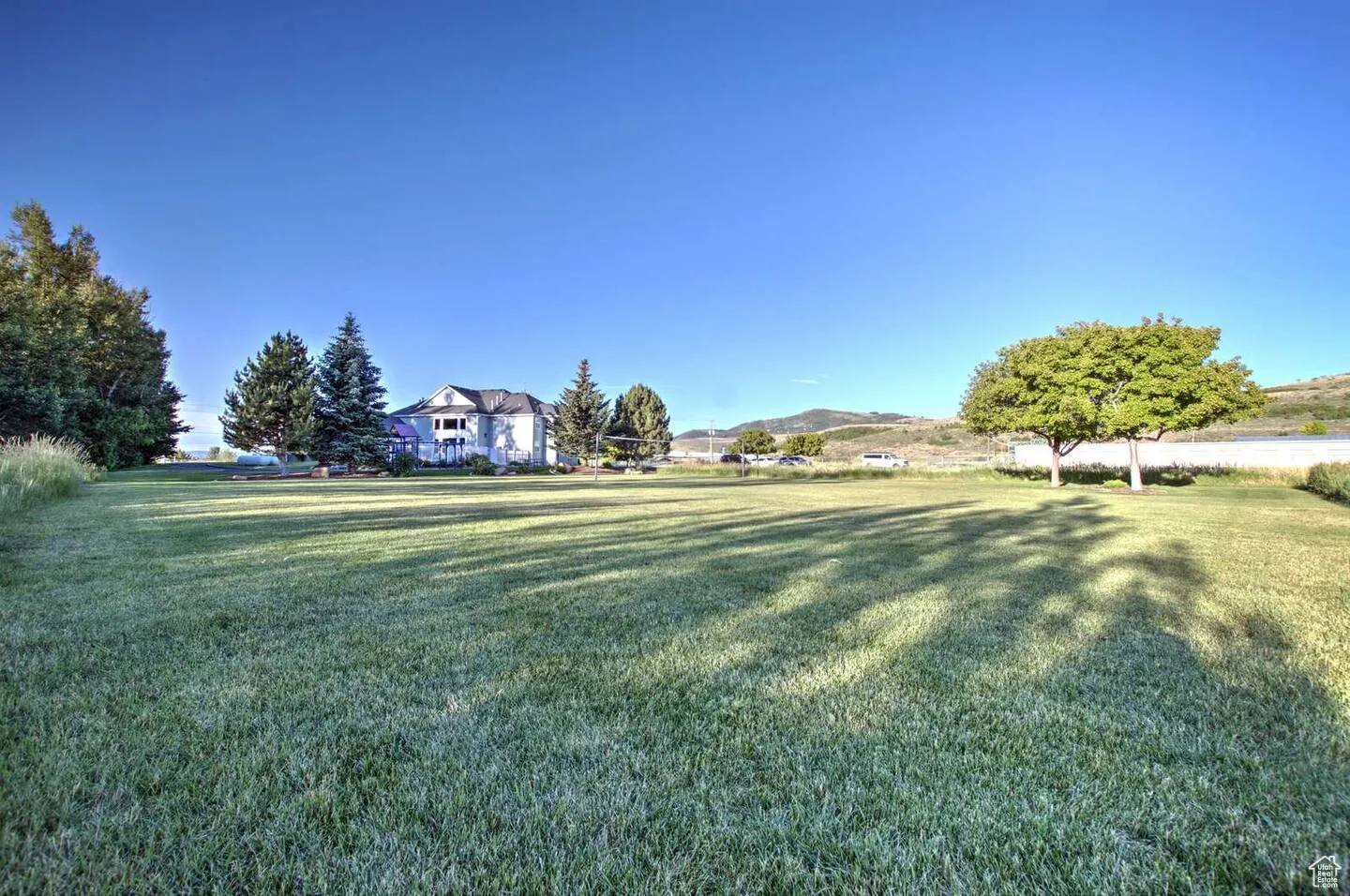 View of green lawn with a mountain view