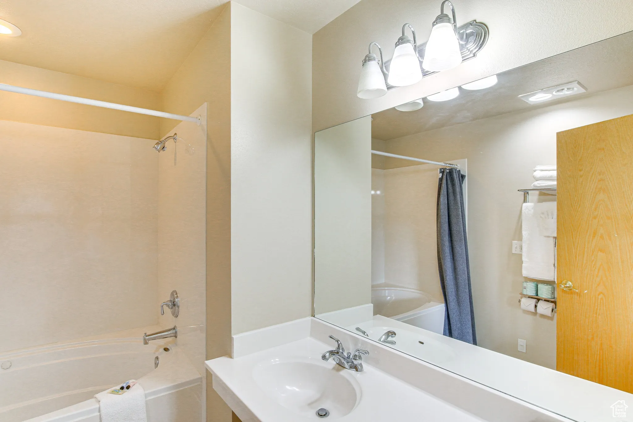 Bathroom with shower / bath combination with curtain, recessed lighting, and vanity