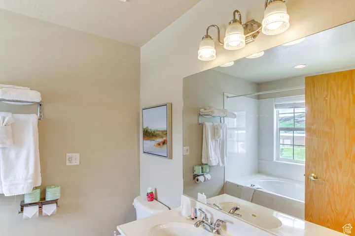 Full bathroom featuring tub / shower combination and vanity