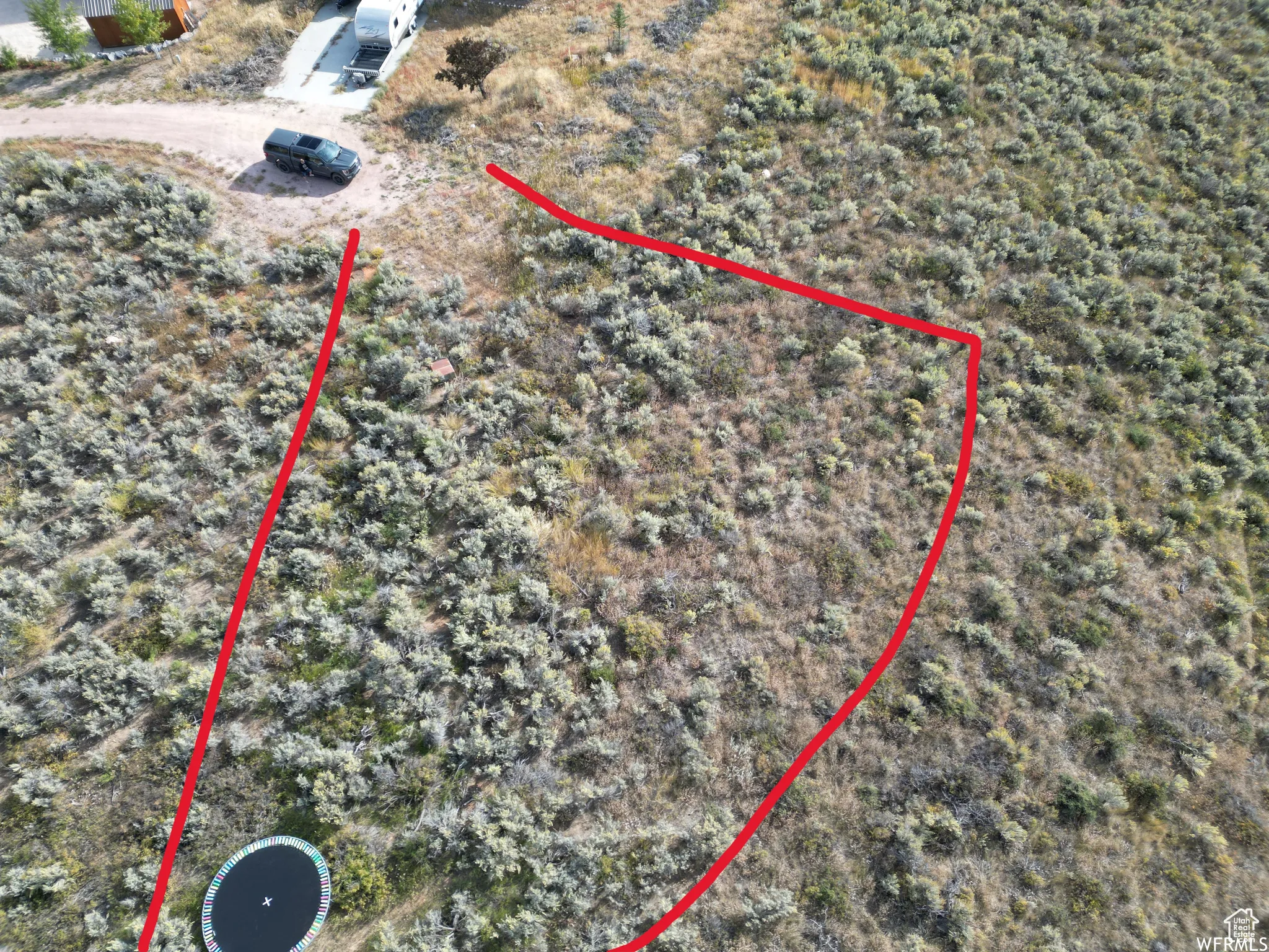 Aerial overview of property's location featuring property parcel outlined