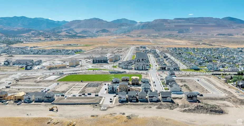 Aerial perspective of suburban area with a mountainous background