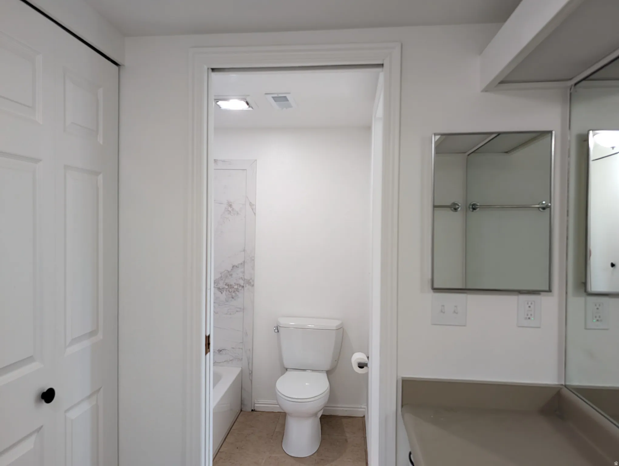 Bathroom featuring vanity and light tile patterned floors