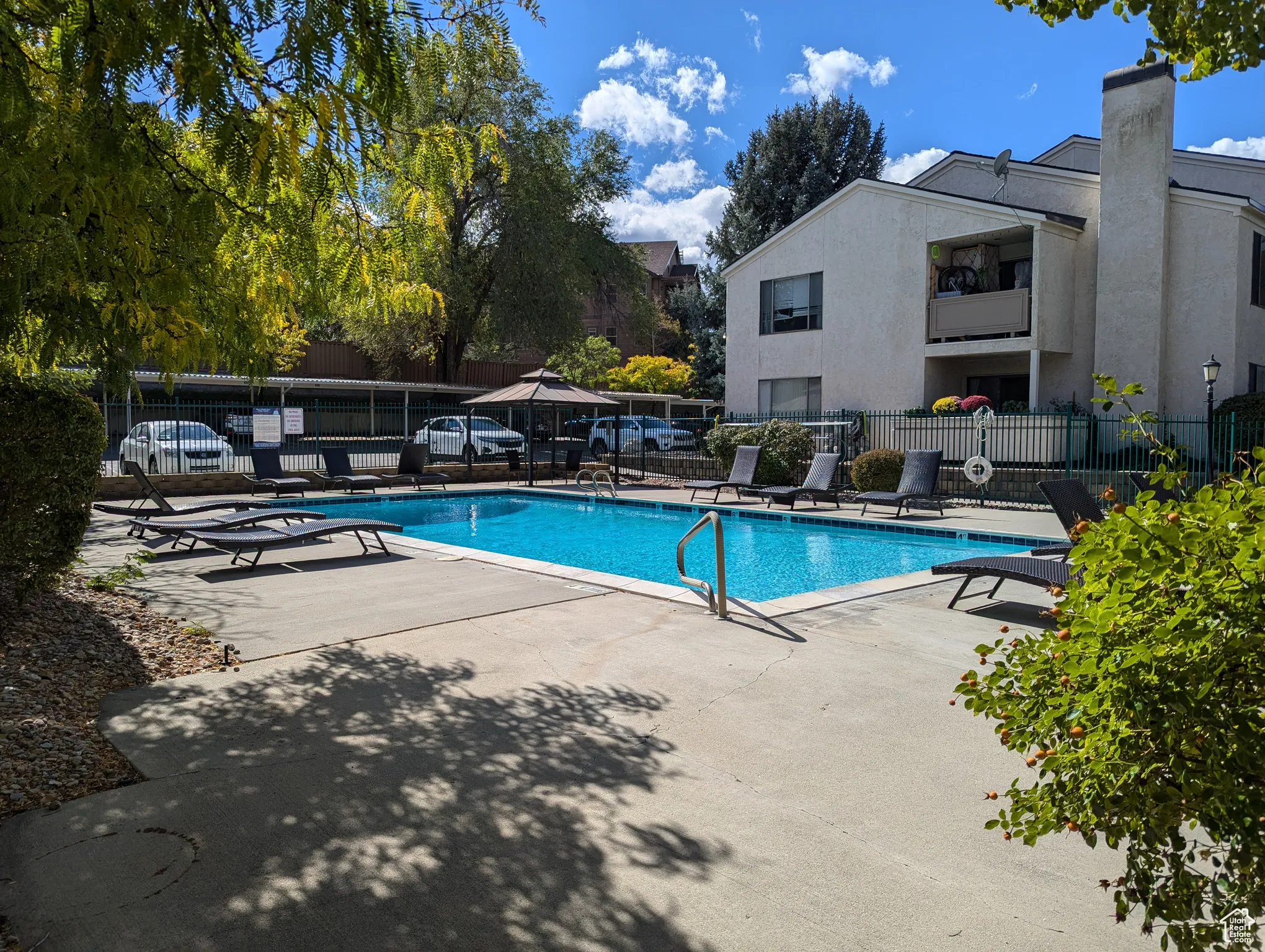 Community pool with a patio