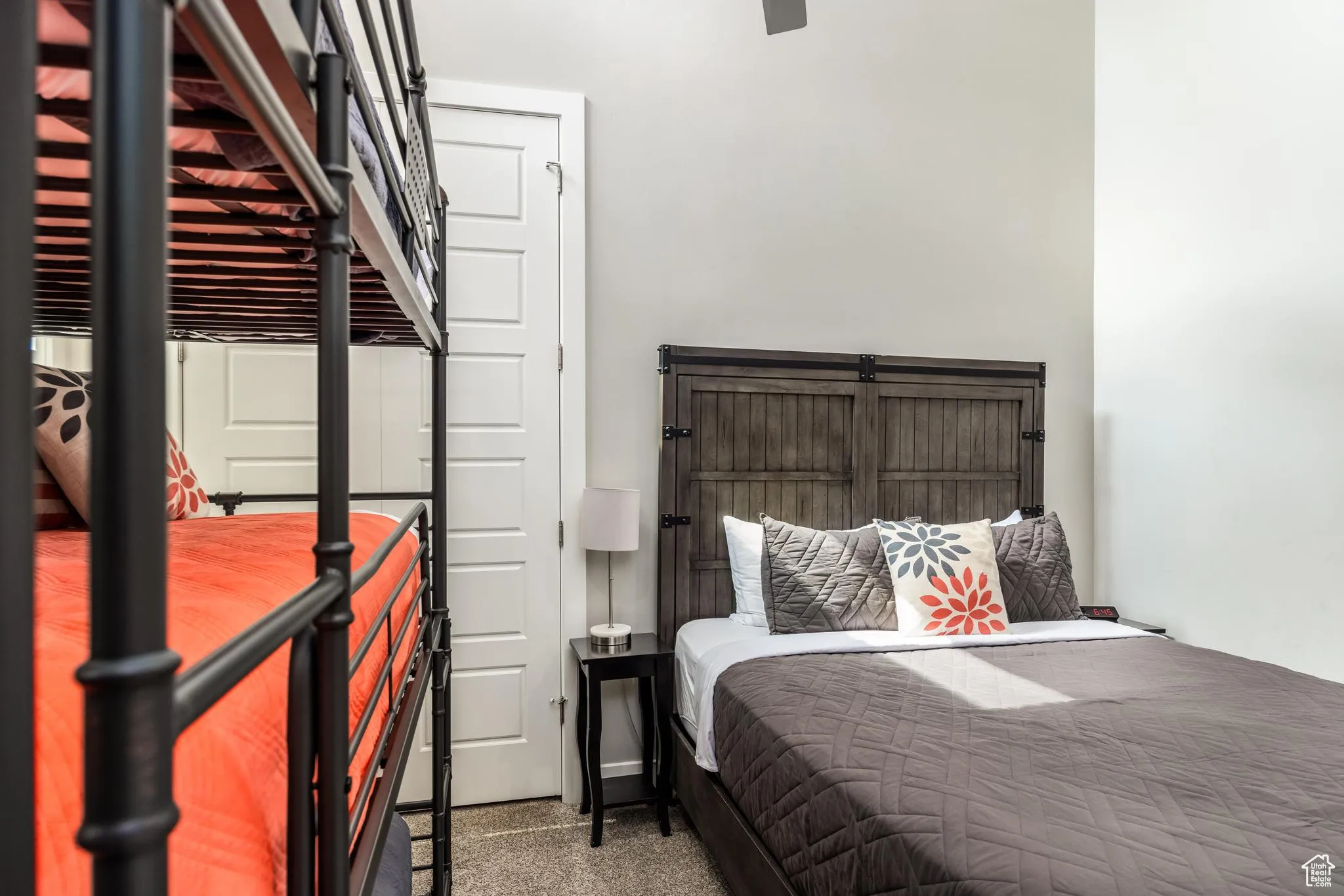 Bedroom with dark colored carpet