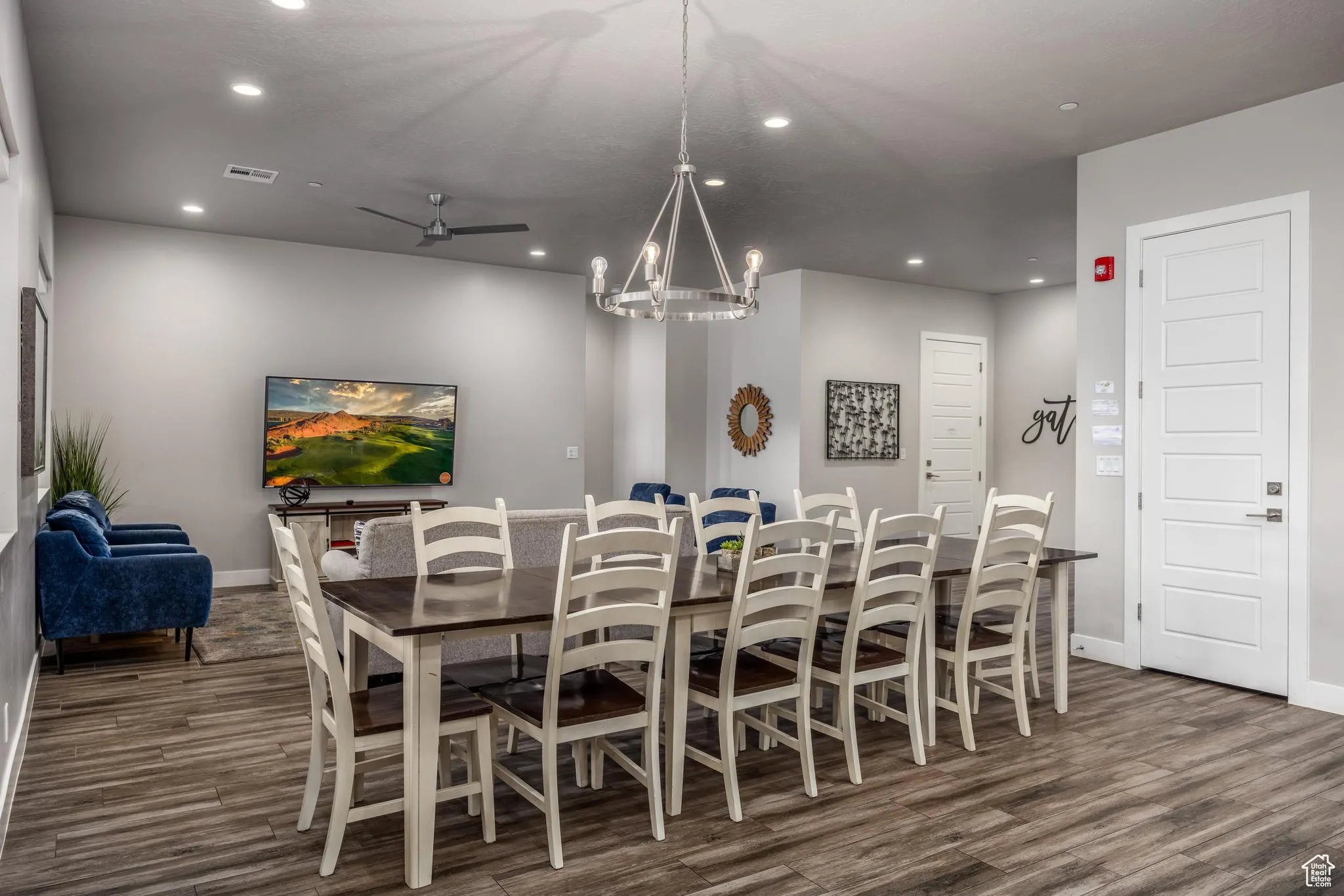 Dining area with recessed lighting, ceiling fan, a chandelier, and dark wood-style floors