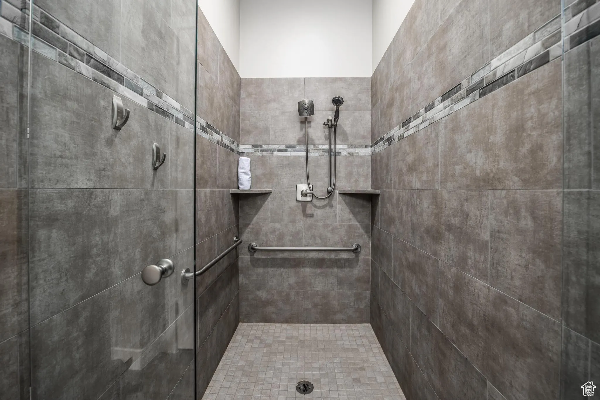 Full bathroom with tiled shower