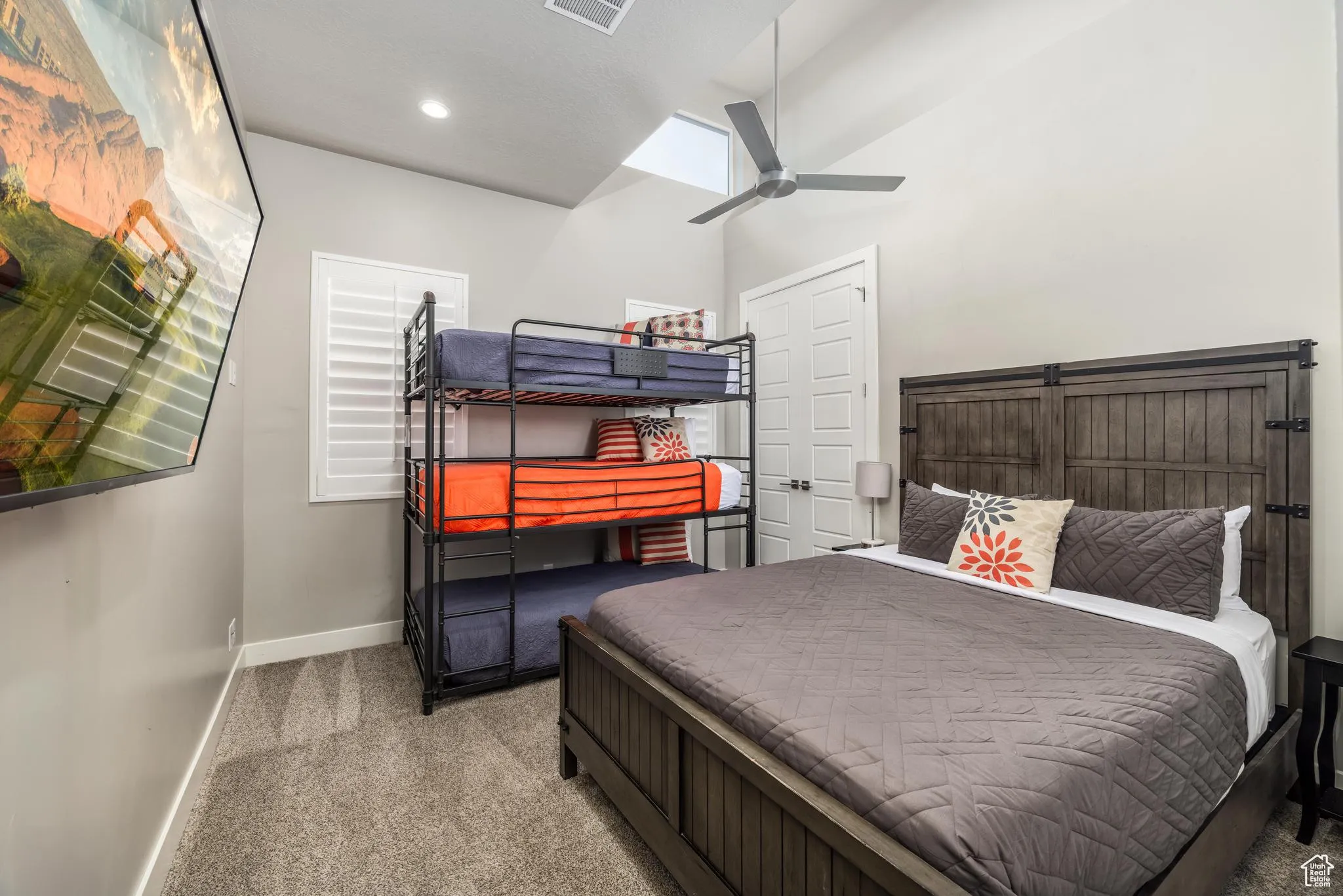 Bedroom featuring carpet flooring, ceiling fan, and lofted ceiling