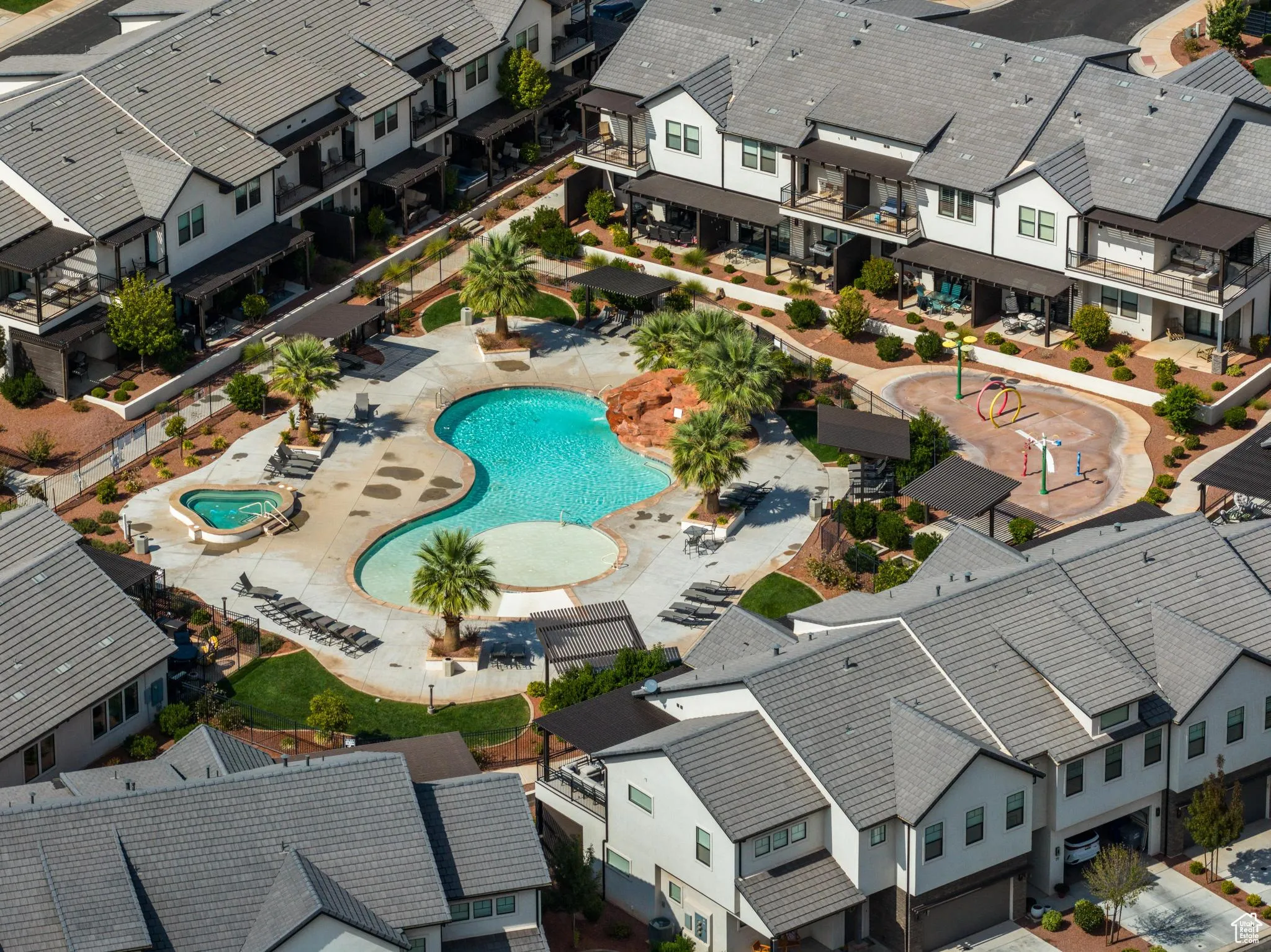 Aerial perspective of suburban area with a pool