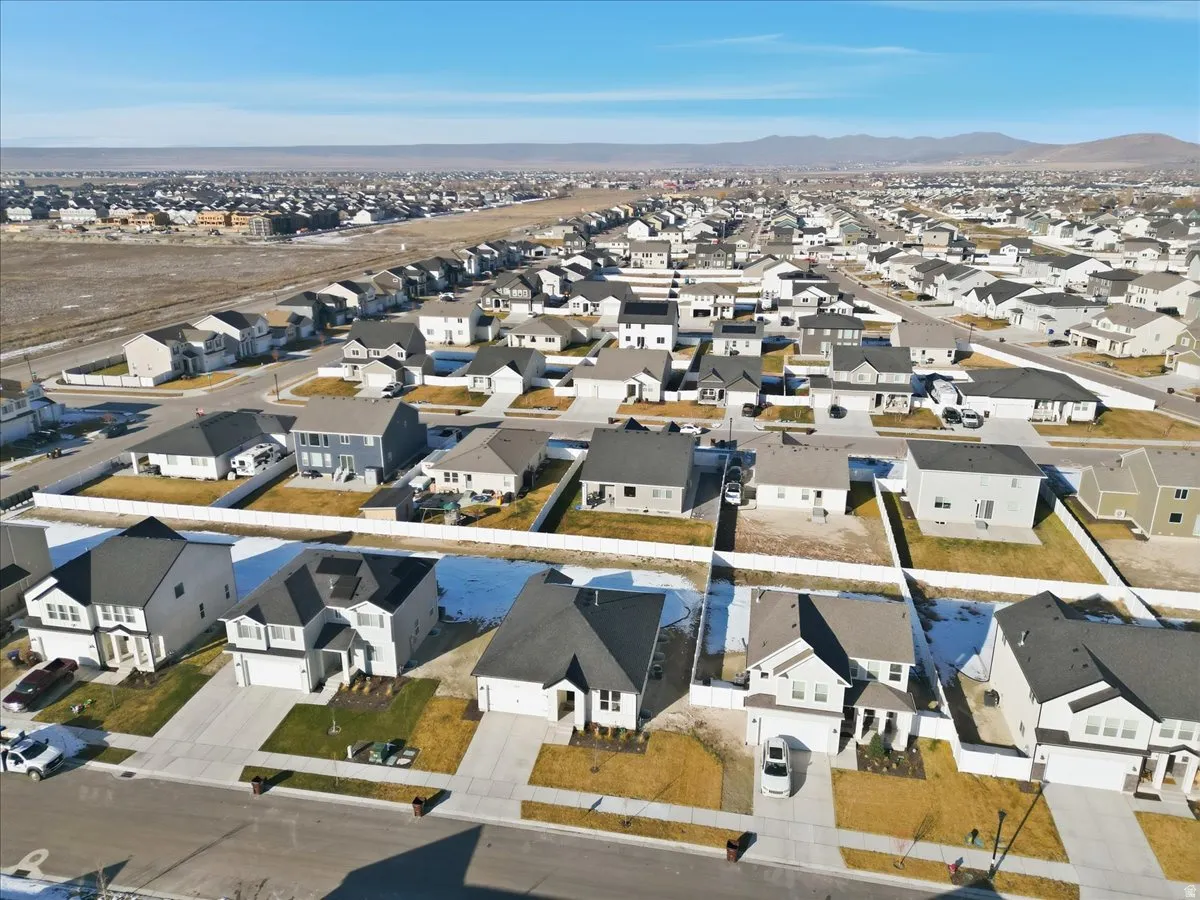 Aerial view of residential area featuring a mountain backdrop