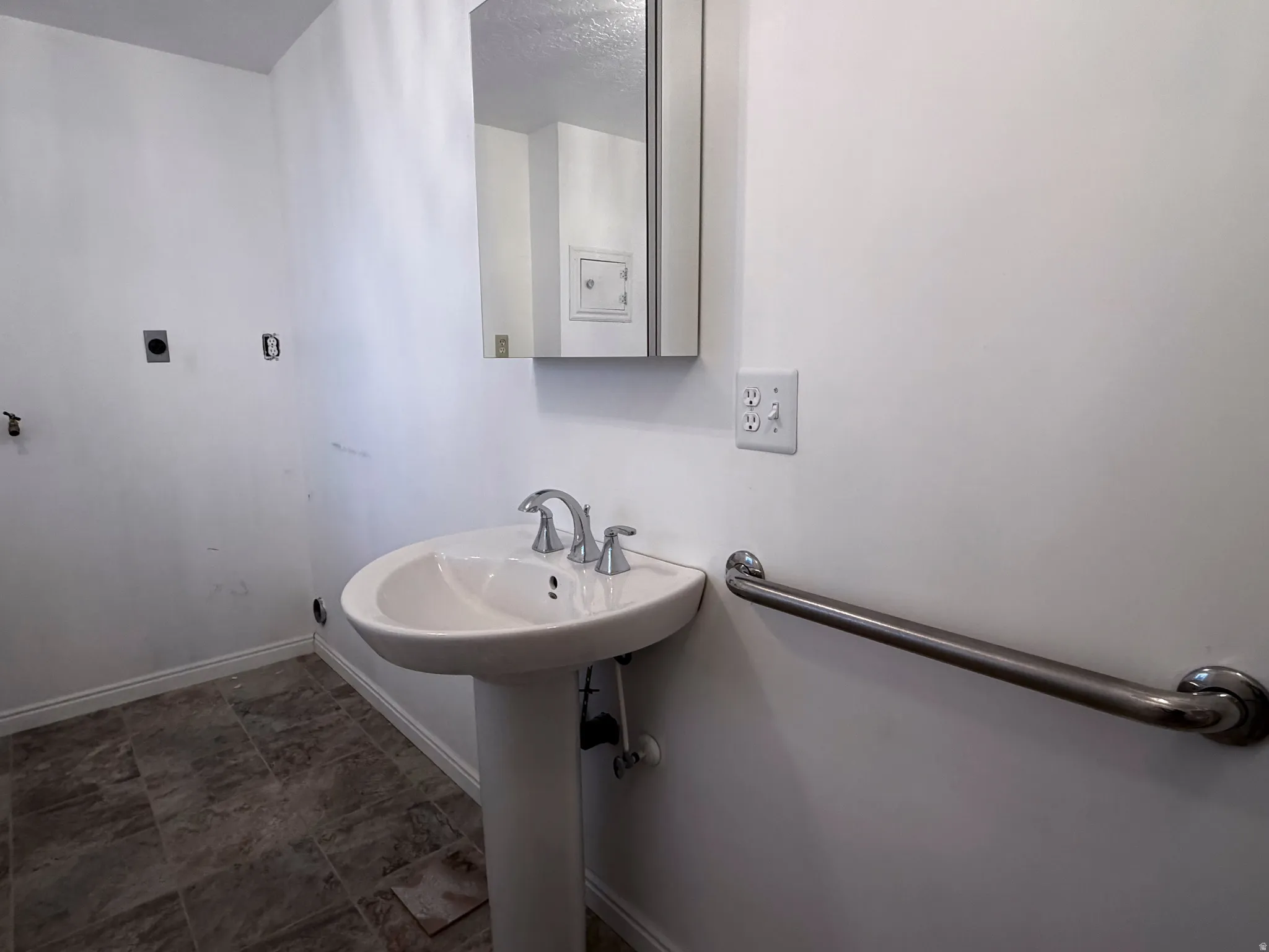 Bathroom featuring baseboards