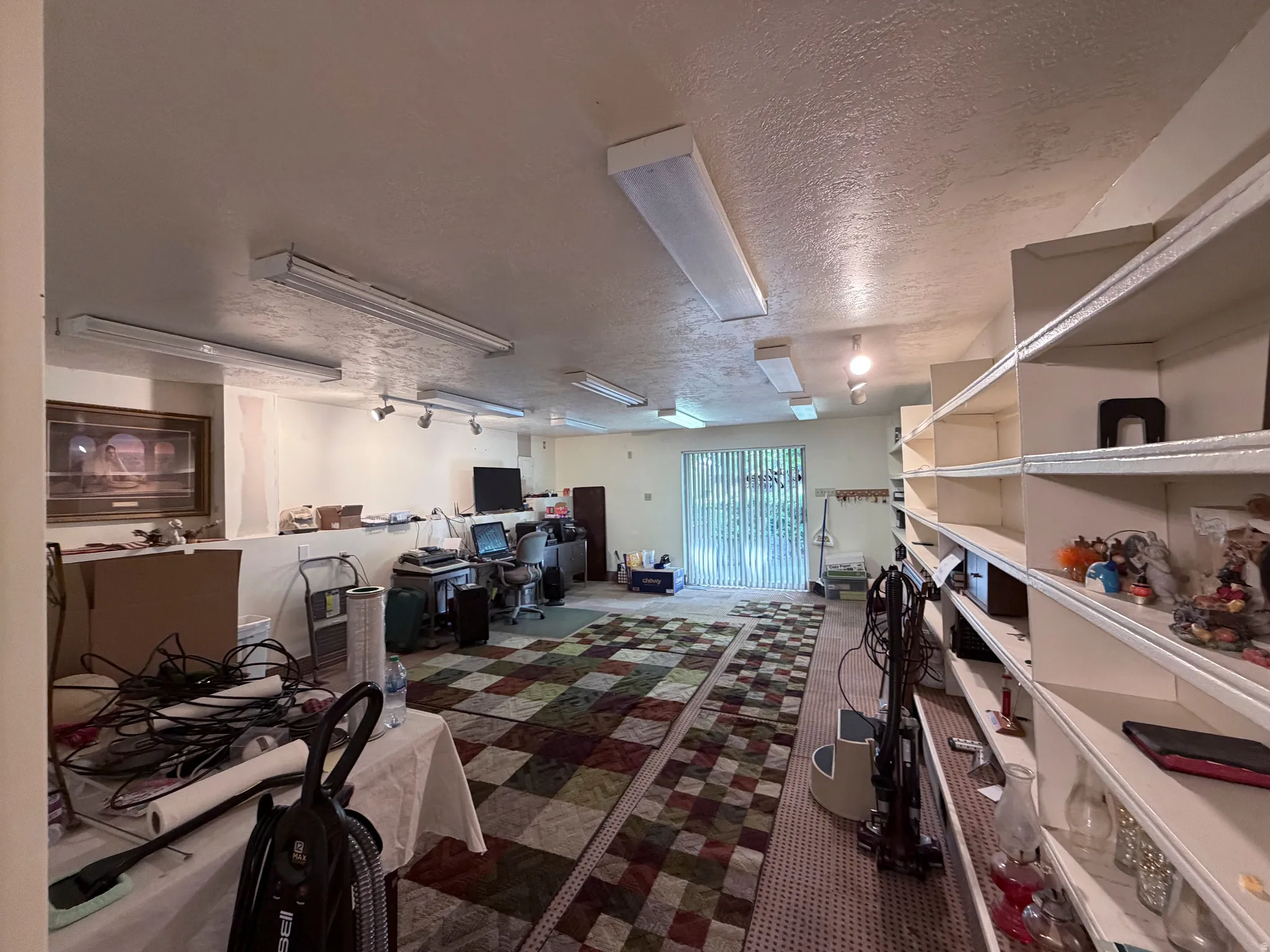 Office space featuring a textured ceiling