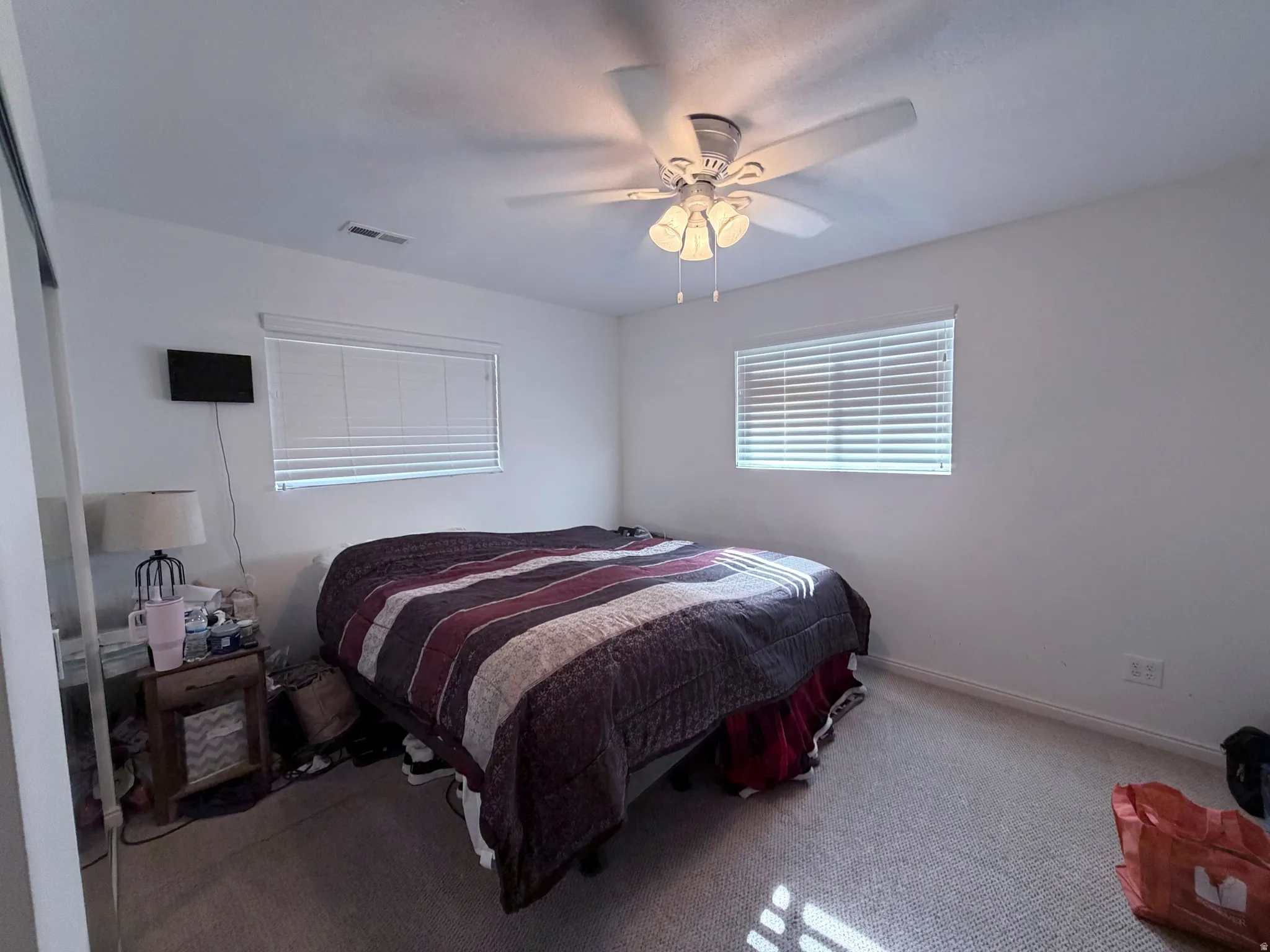 Bedroom with carpet floors and ceiling fan