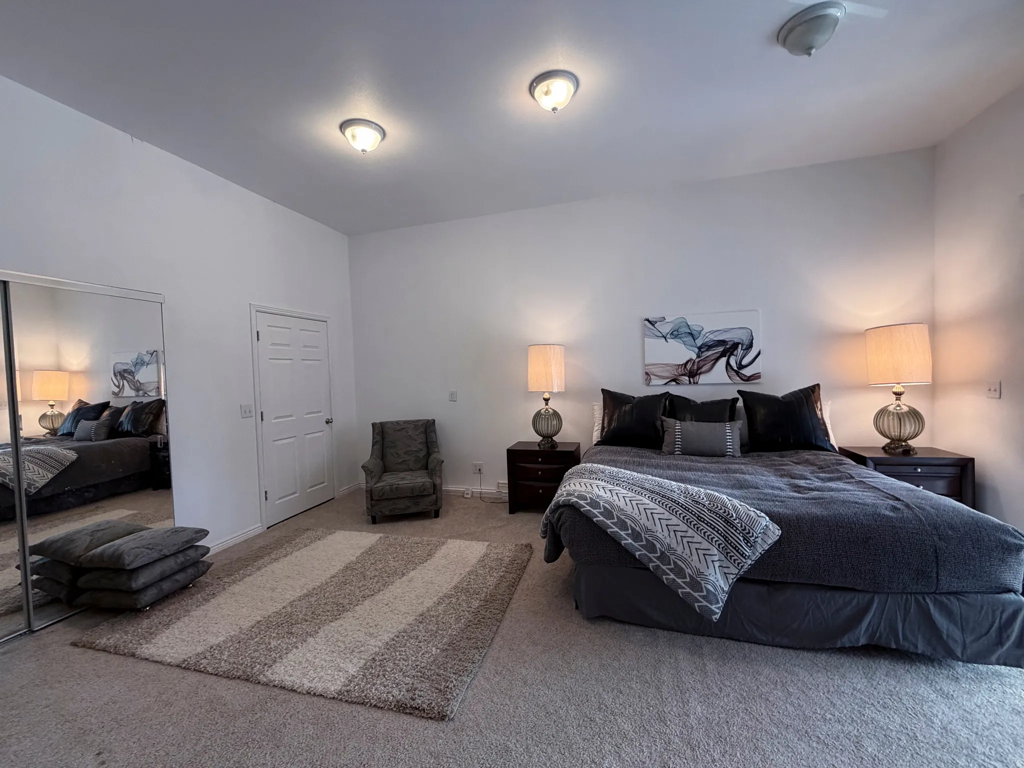Bedroom featuring carpet floors and baseboards