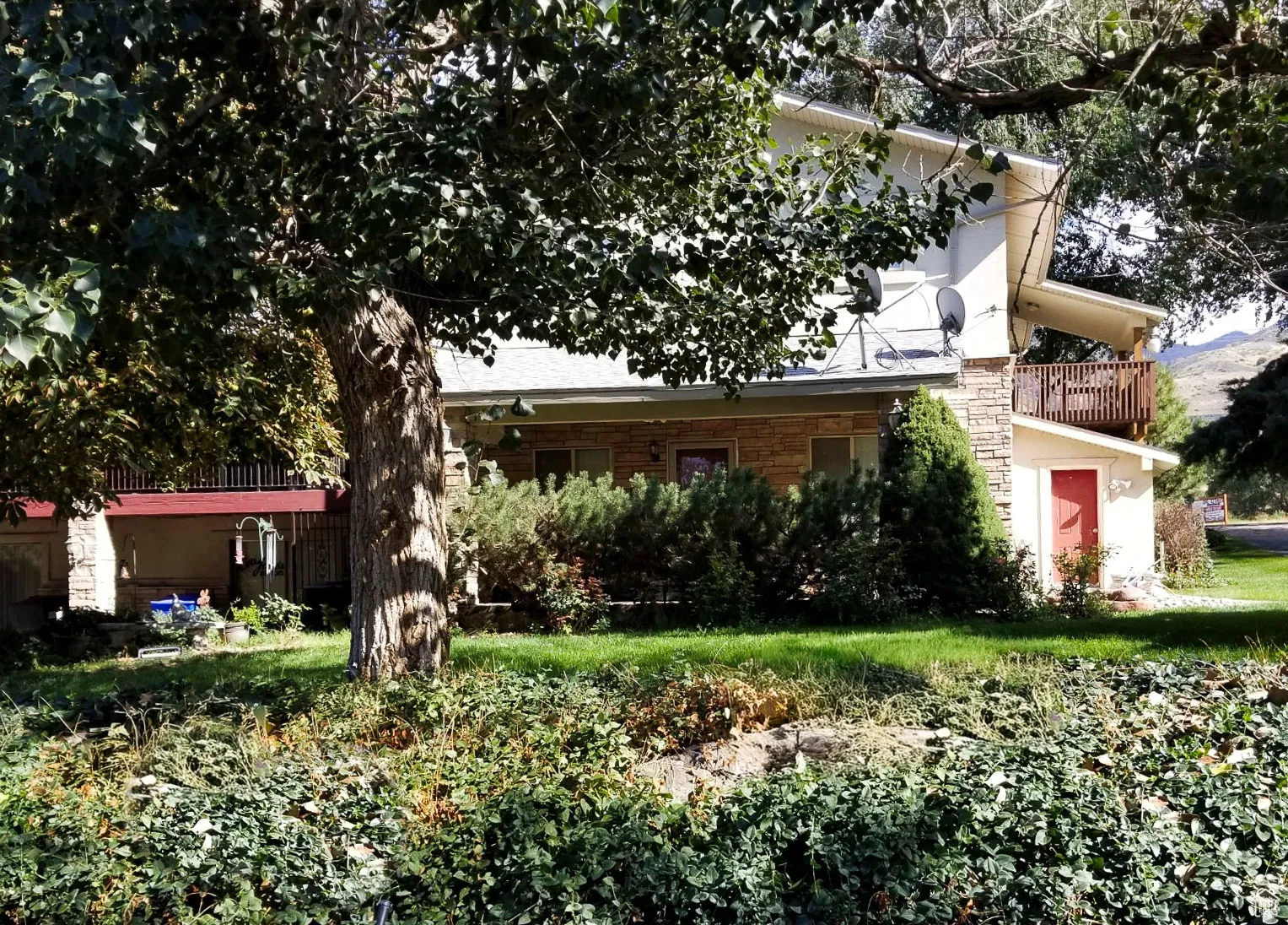 View of front of house featuring a balcony