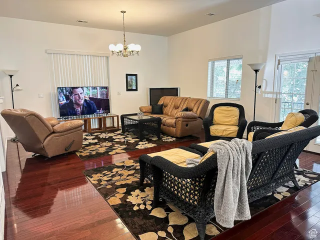 ADU -Living area with dark wood finished floors and French doors