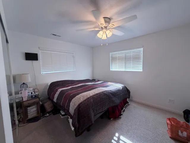 Bedroom with carpet floors and ceiling fan