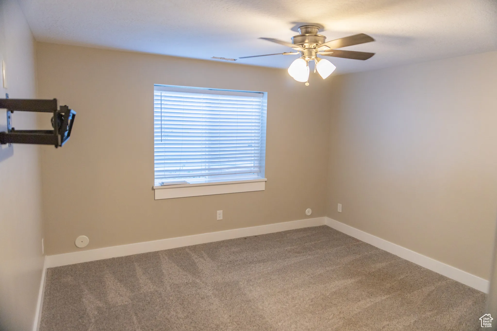 Basement apartment Master bedroom featuring carpet and ceiling fan