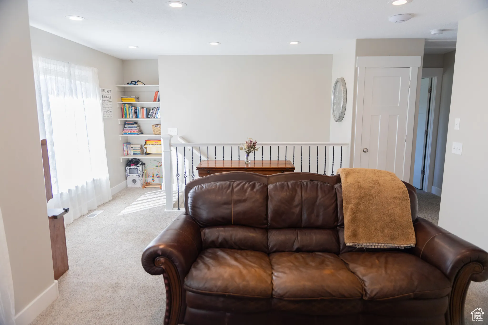 Living area featuring carpet and recessed lighting