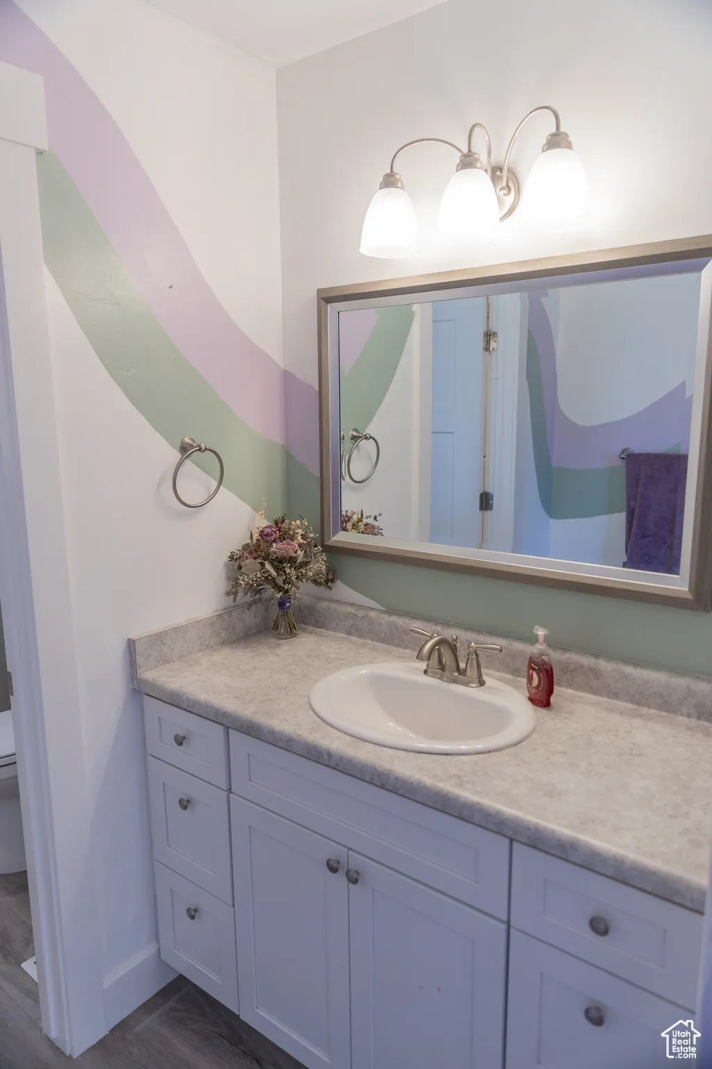 Jack and Jill bathroom featuring vanity and toilet