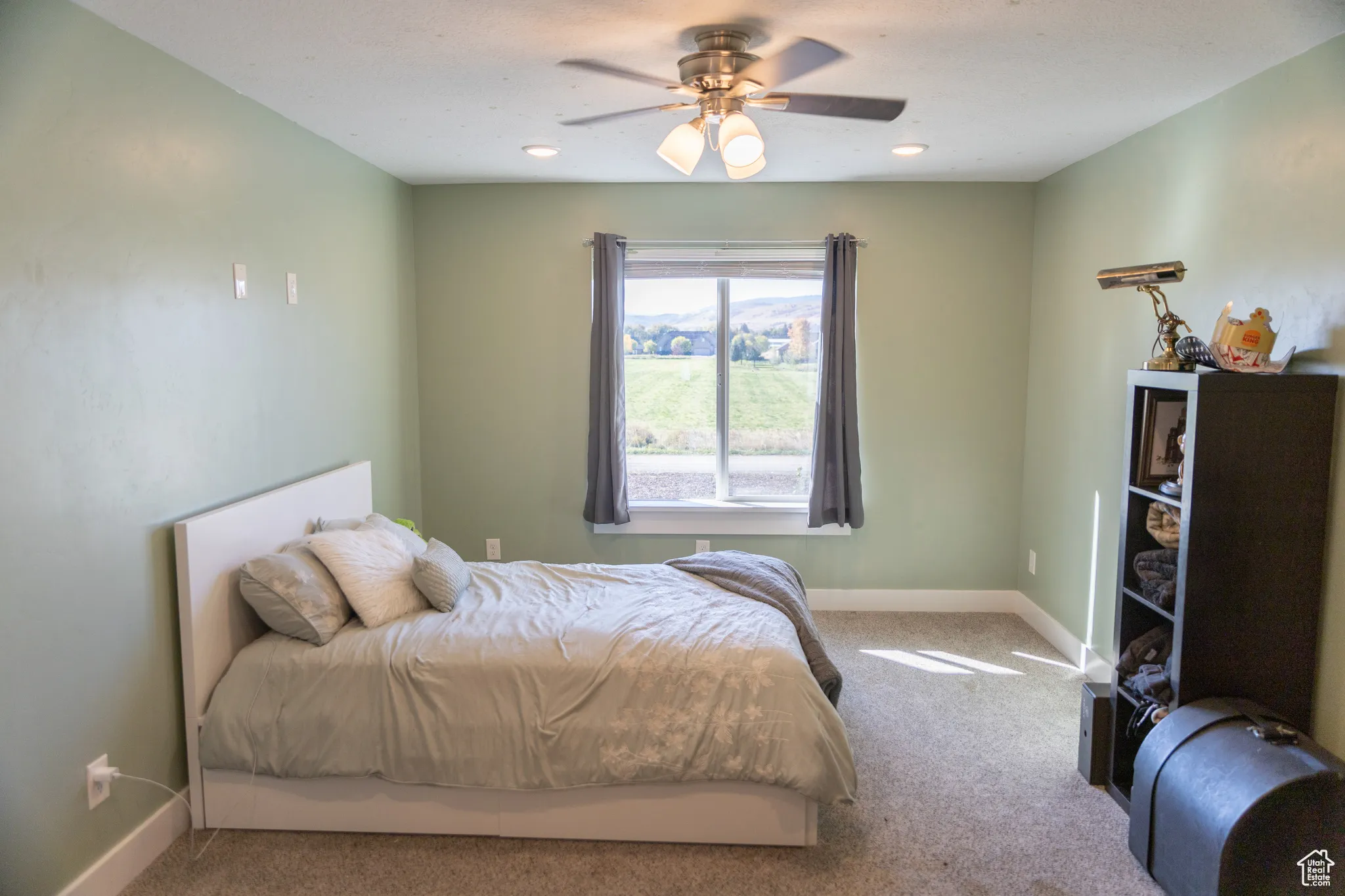 Bedroom featuring carpet floors and ceiling fan