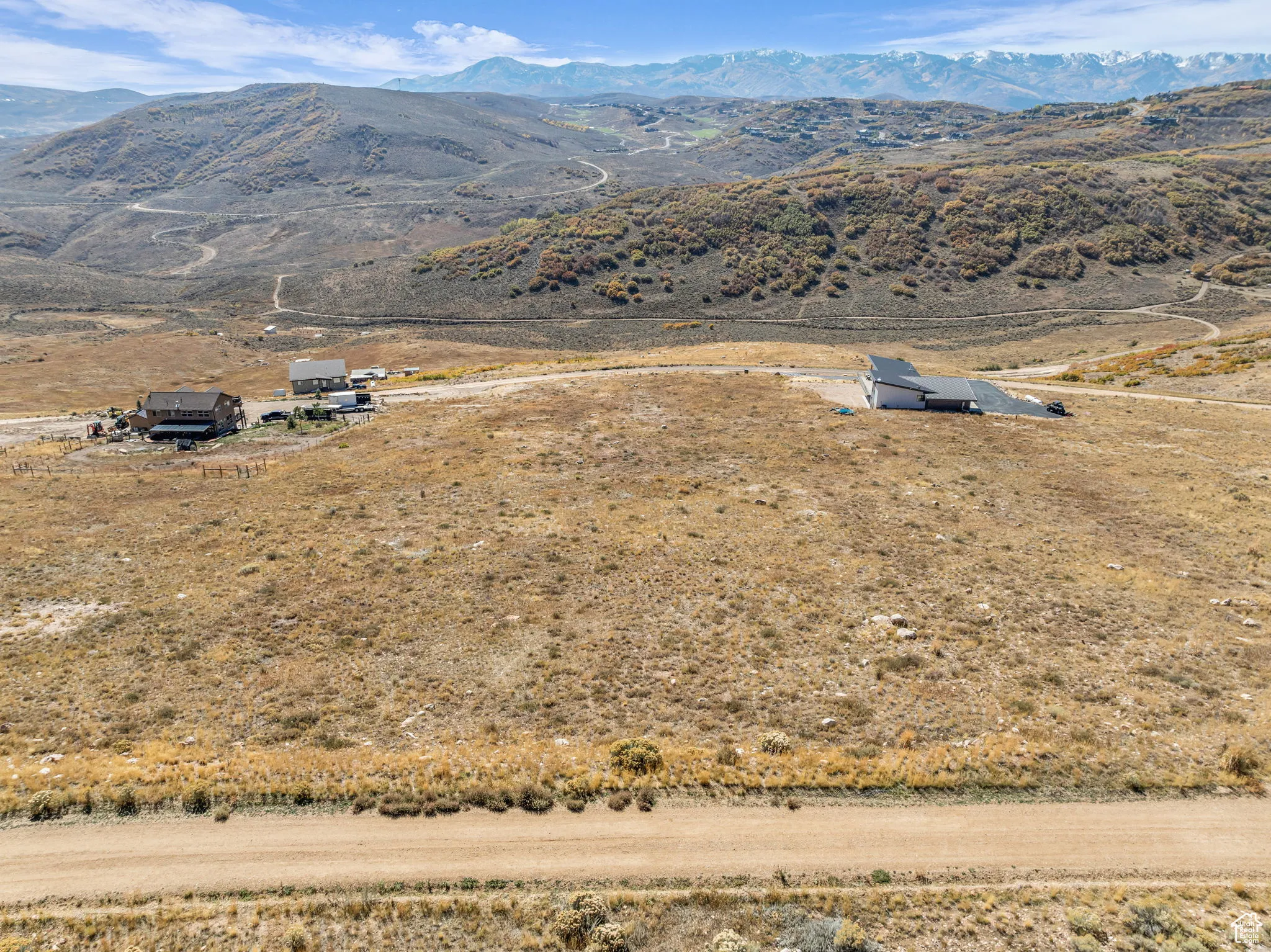Aerial view of sparsely populated area with a mountain backdrop
