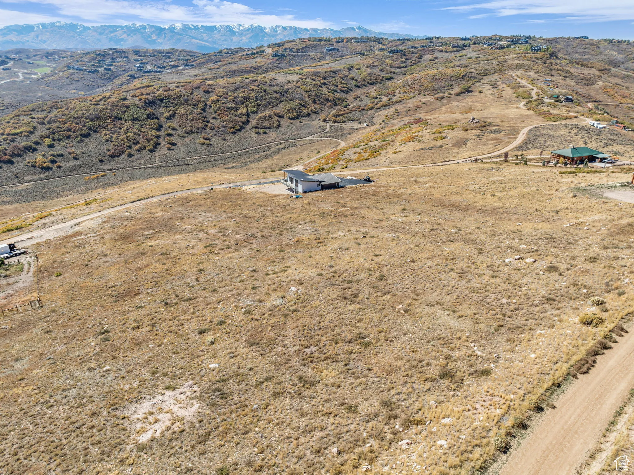Aerial view of sparsely populated area with a mountainous background