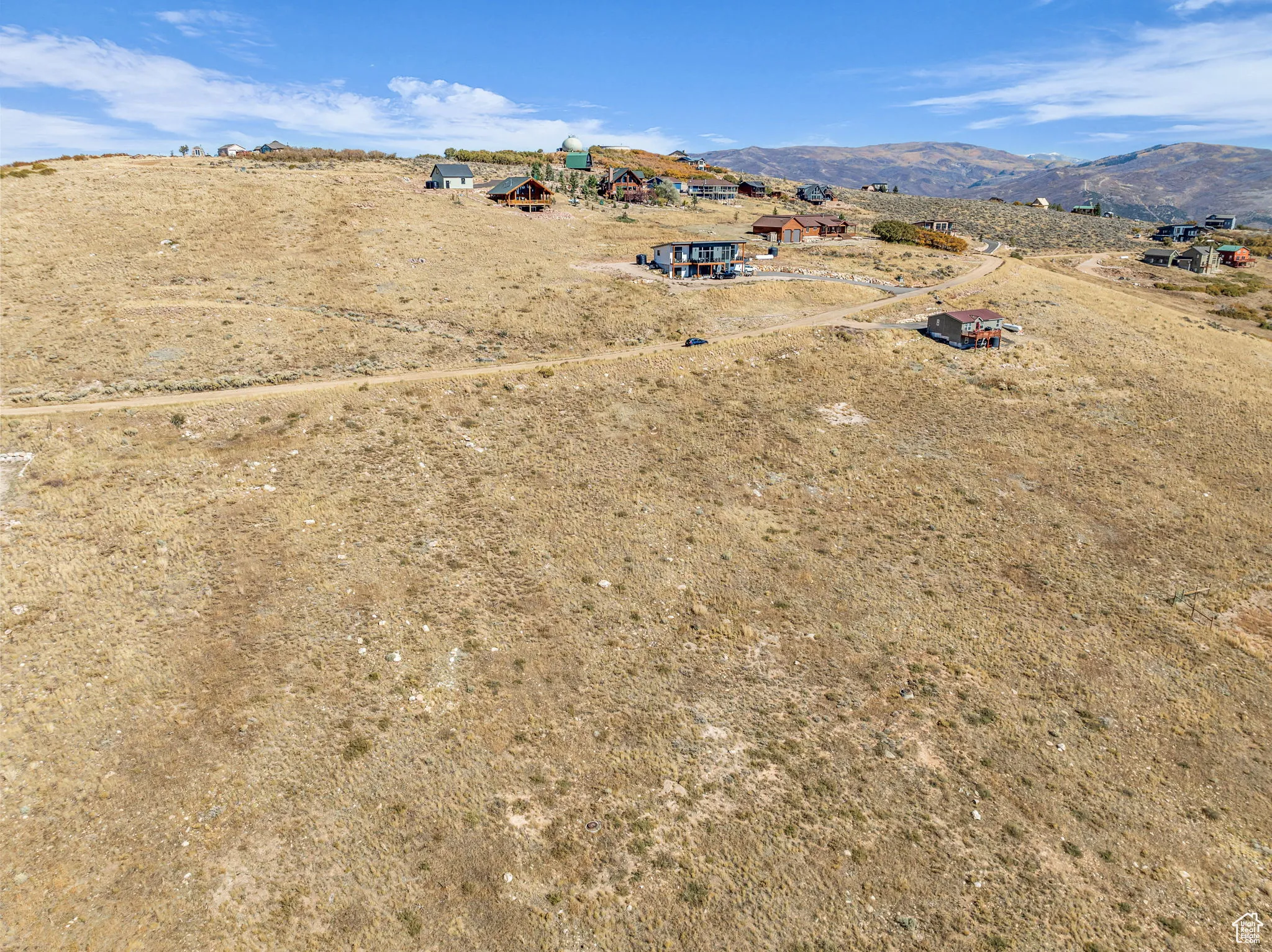 Overview of rural landscape featuring a mountainous background
