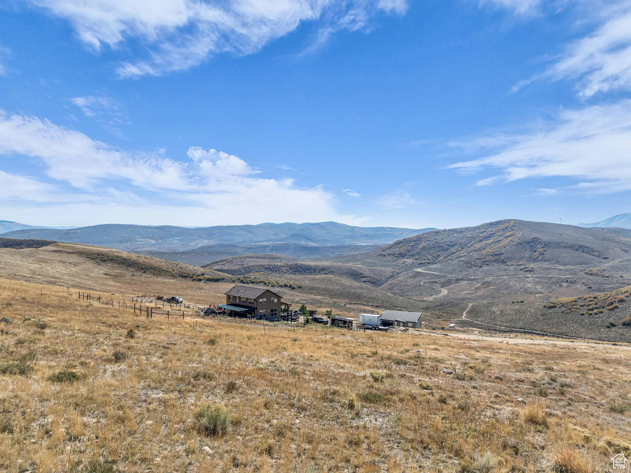 View of mountain background featuring rural landscape