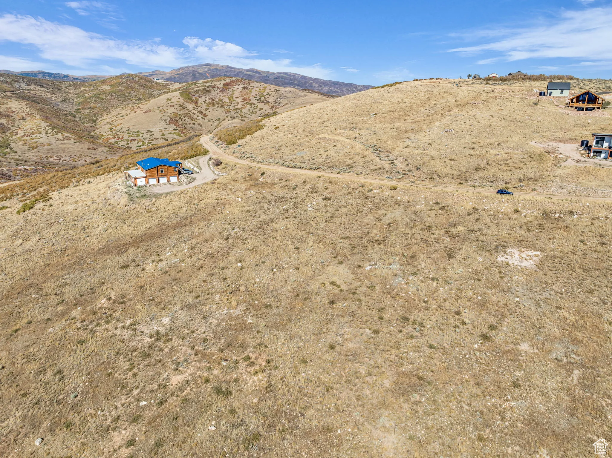Aerial view of sparsely populated area with a mountain backdrop