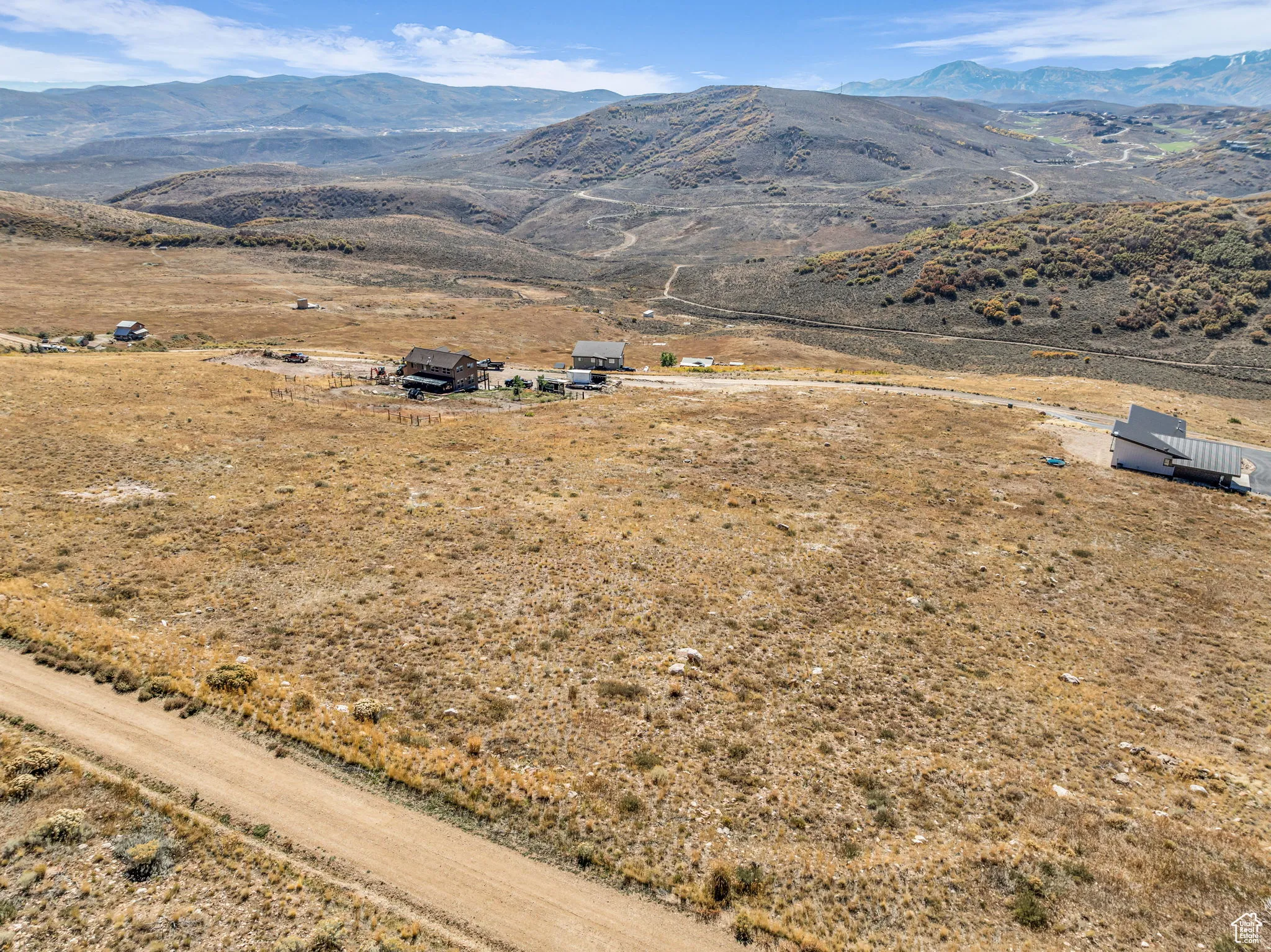 Aerial view of sparsely populated area with a mountainous background