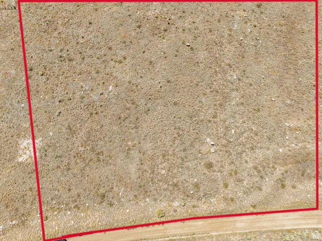 Aerial view of property and surrounding area featuring property boundaries highlighted