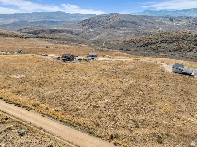Aerial view of sparsely populated area with a mountainous background