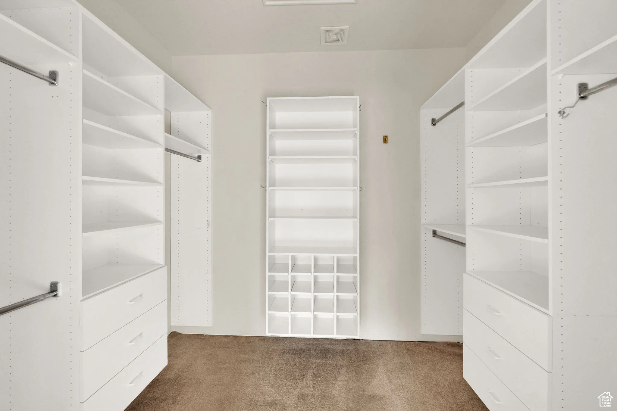 Mater walk-in closet with built in  storage.