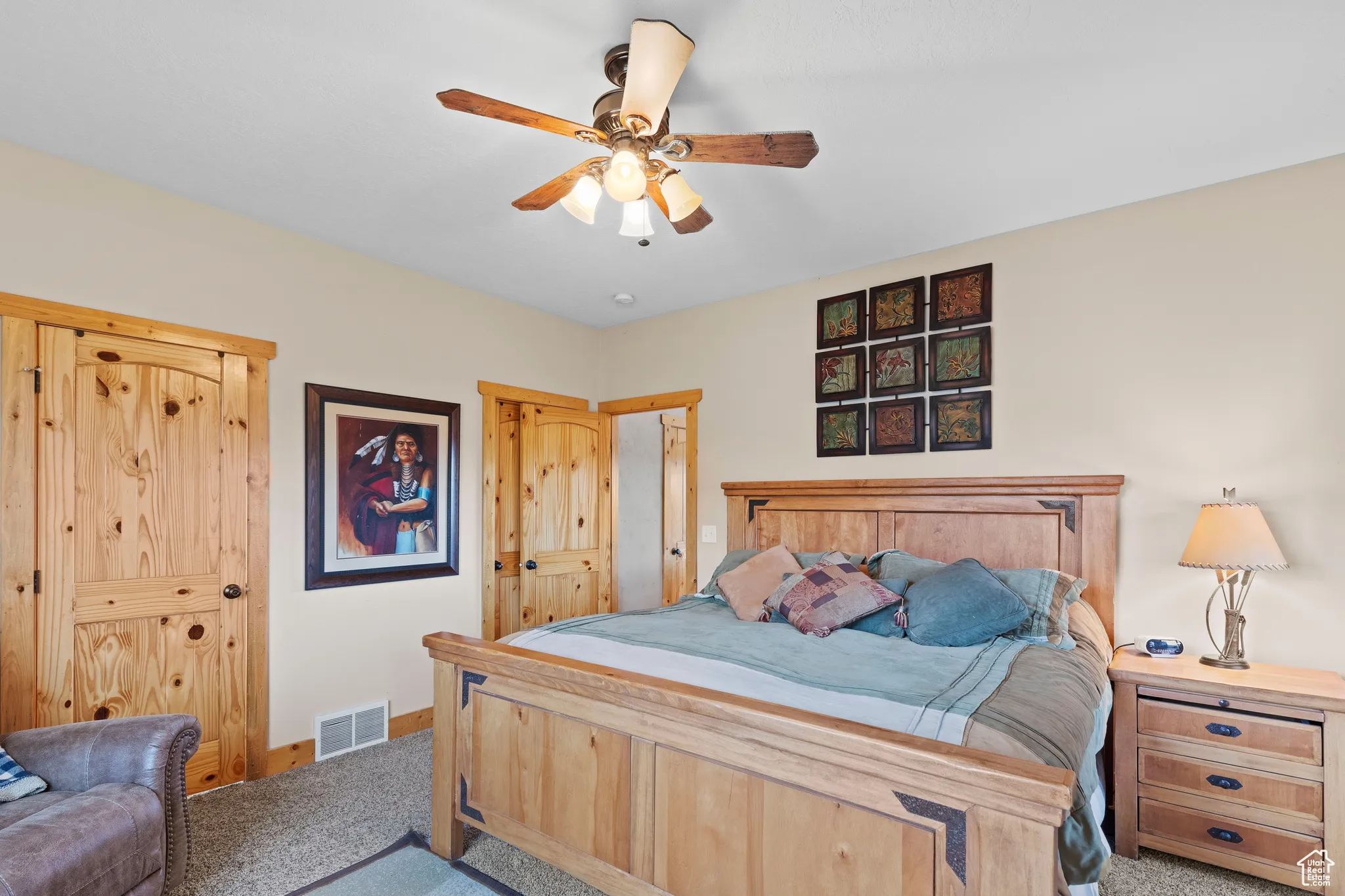 Bedroom featuring carpet and ceiling fan