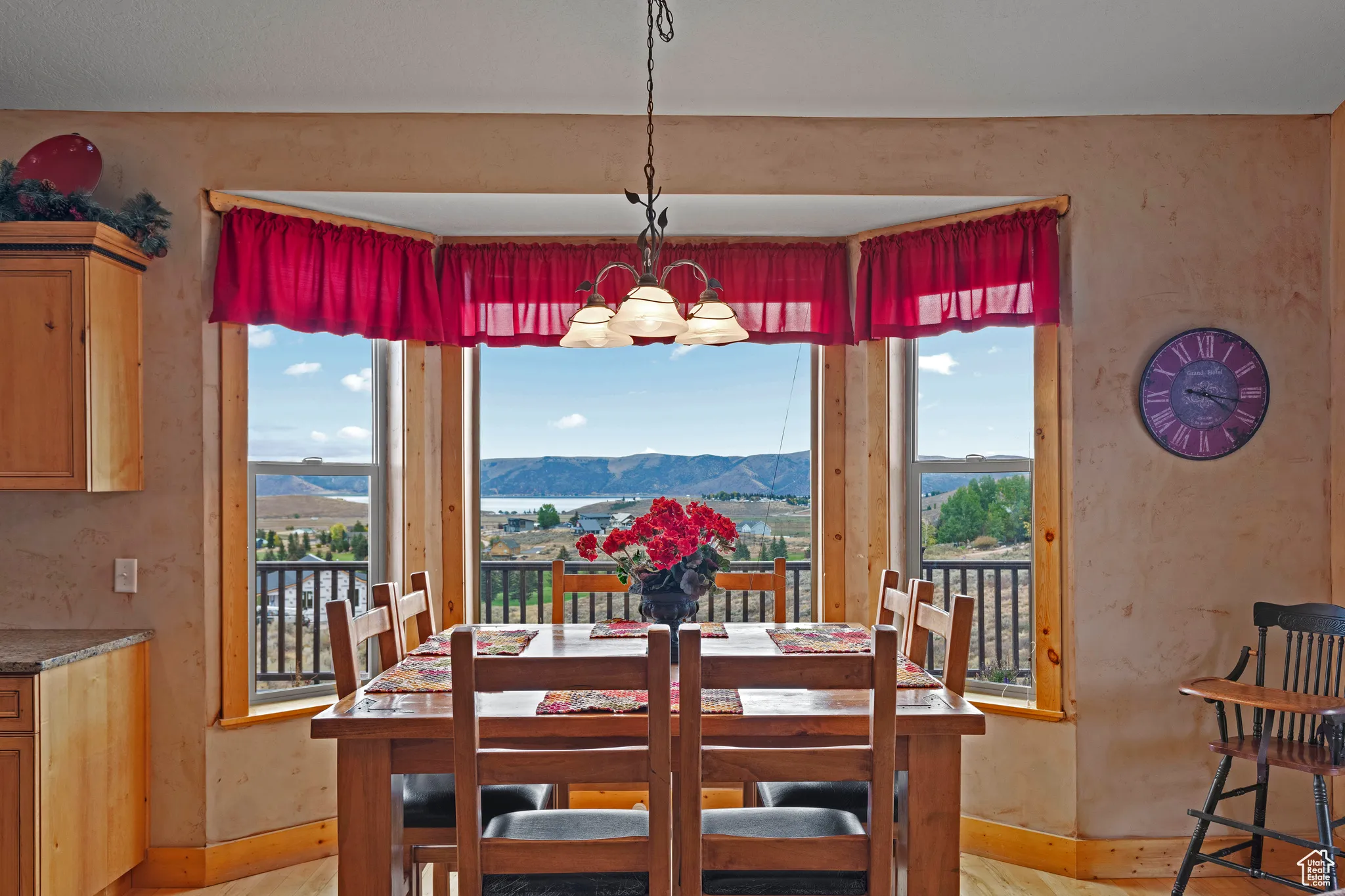 Dining room with a mountain view and a chandelier