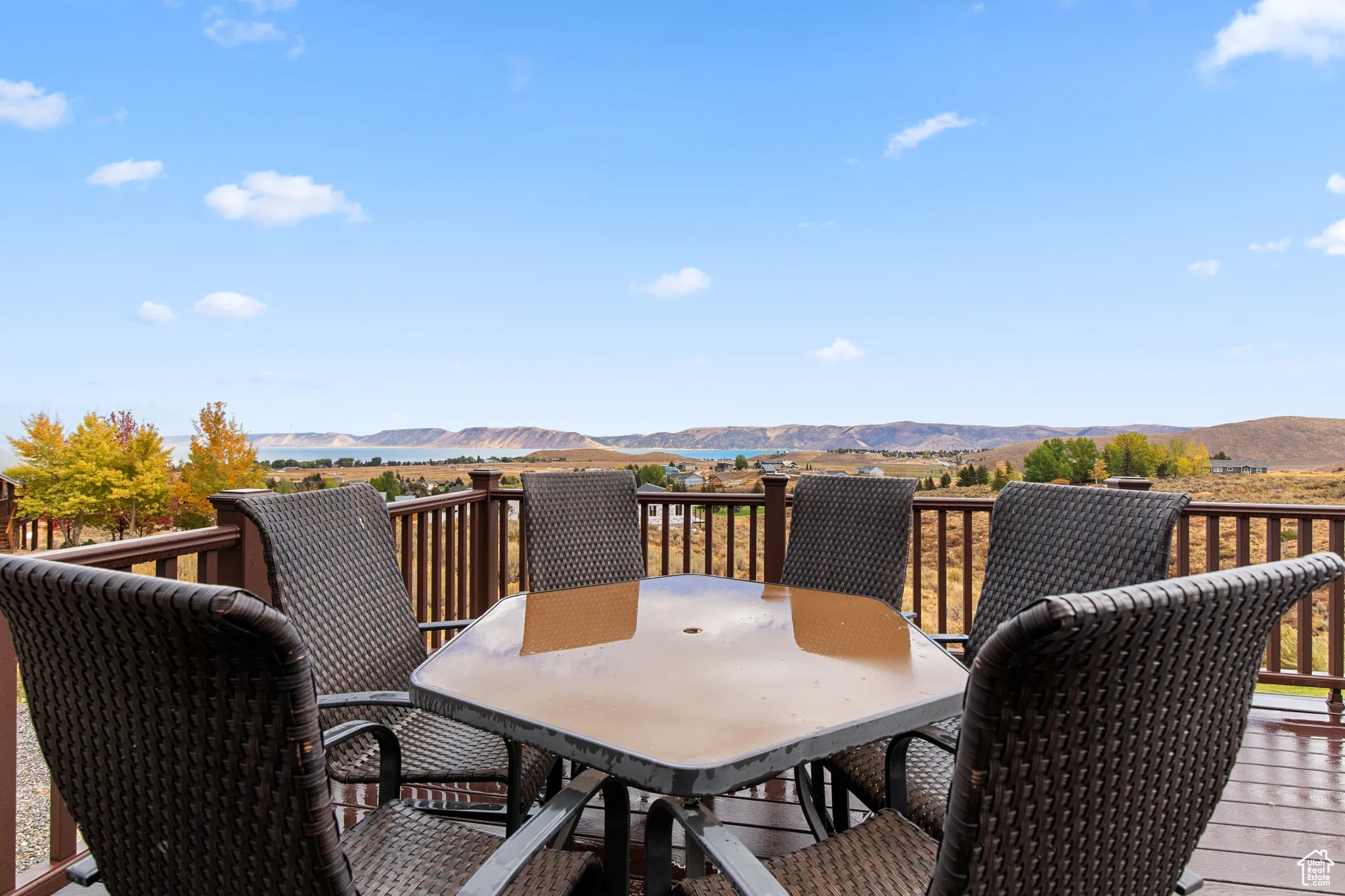 Wooden terrace with a mountain view and outdoor dining space