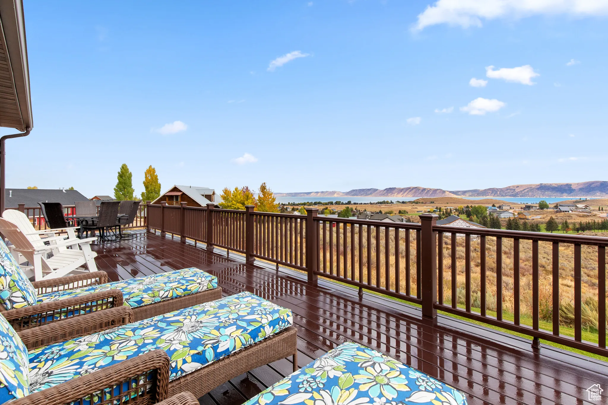 Wooden deck with a mountain view and outdoor dining area