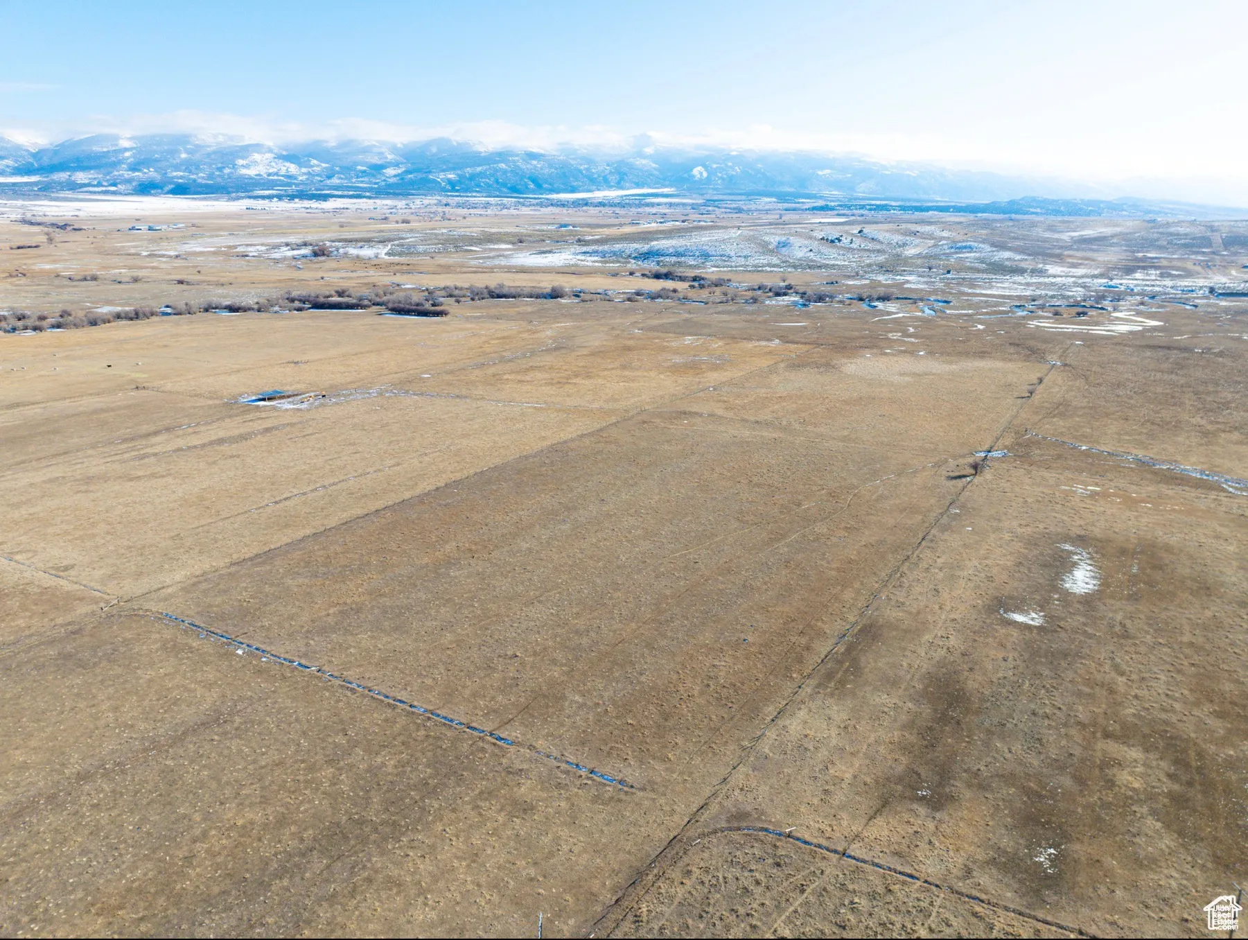 Aerial view of sparsely populated area featuring a mountainous background