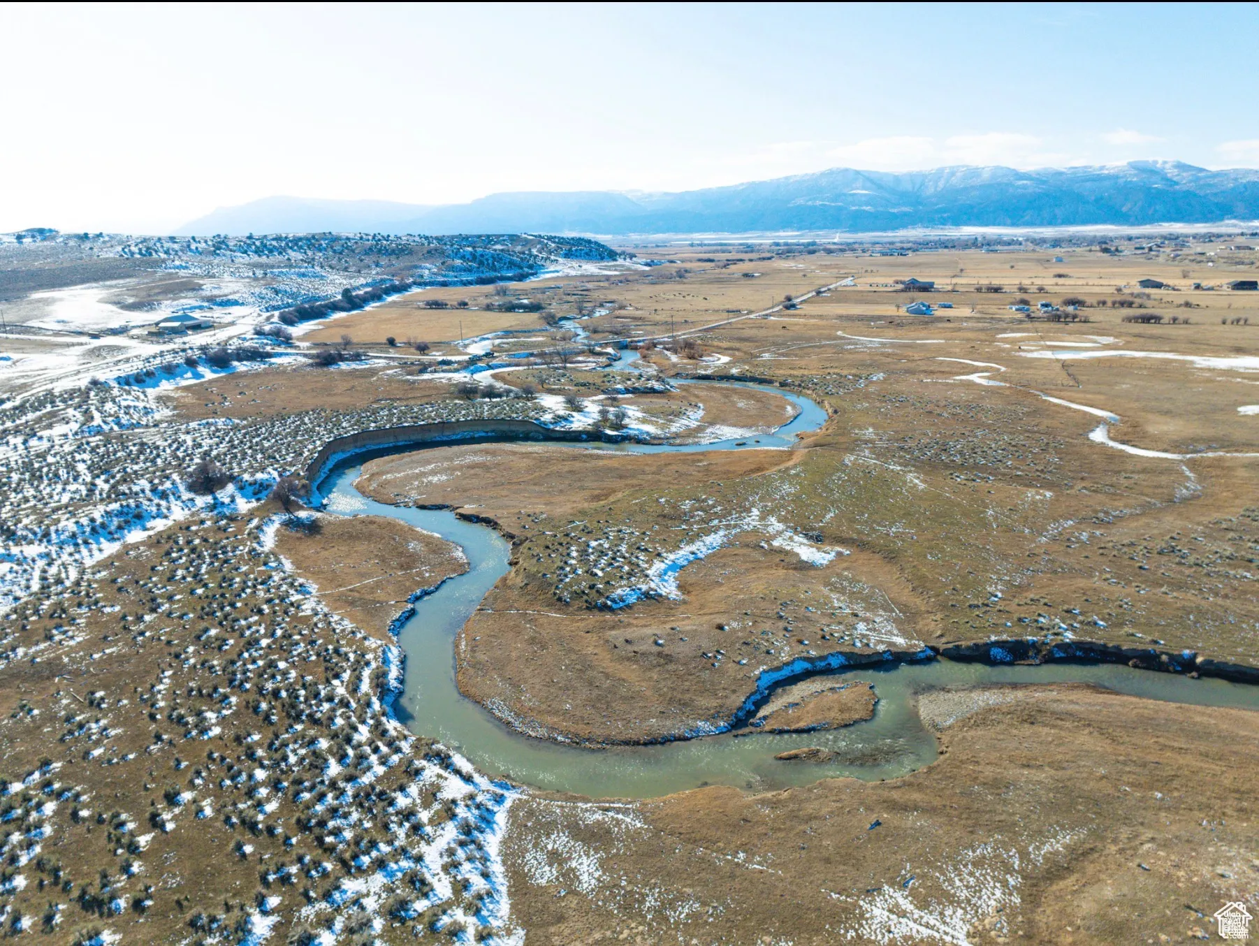 Overview of rural landscape with a mountain backdrop