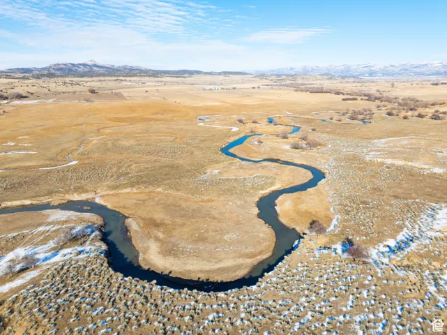 Aerial view of property's location featuring mountains and rural landscape