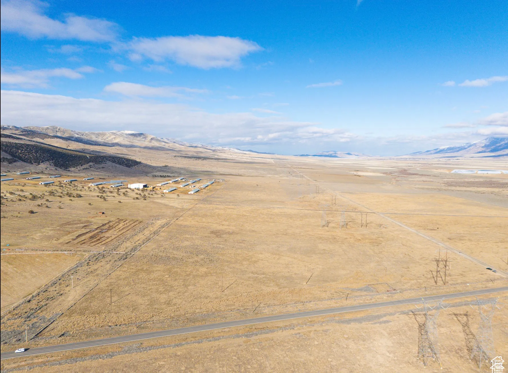 Aerial view of sparsely populated area featuring a mountain backdrop