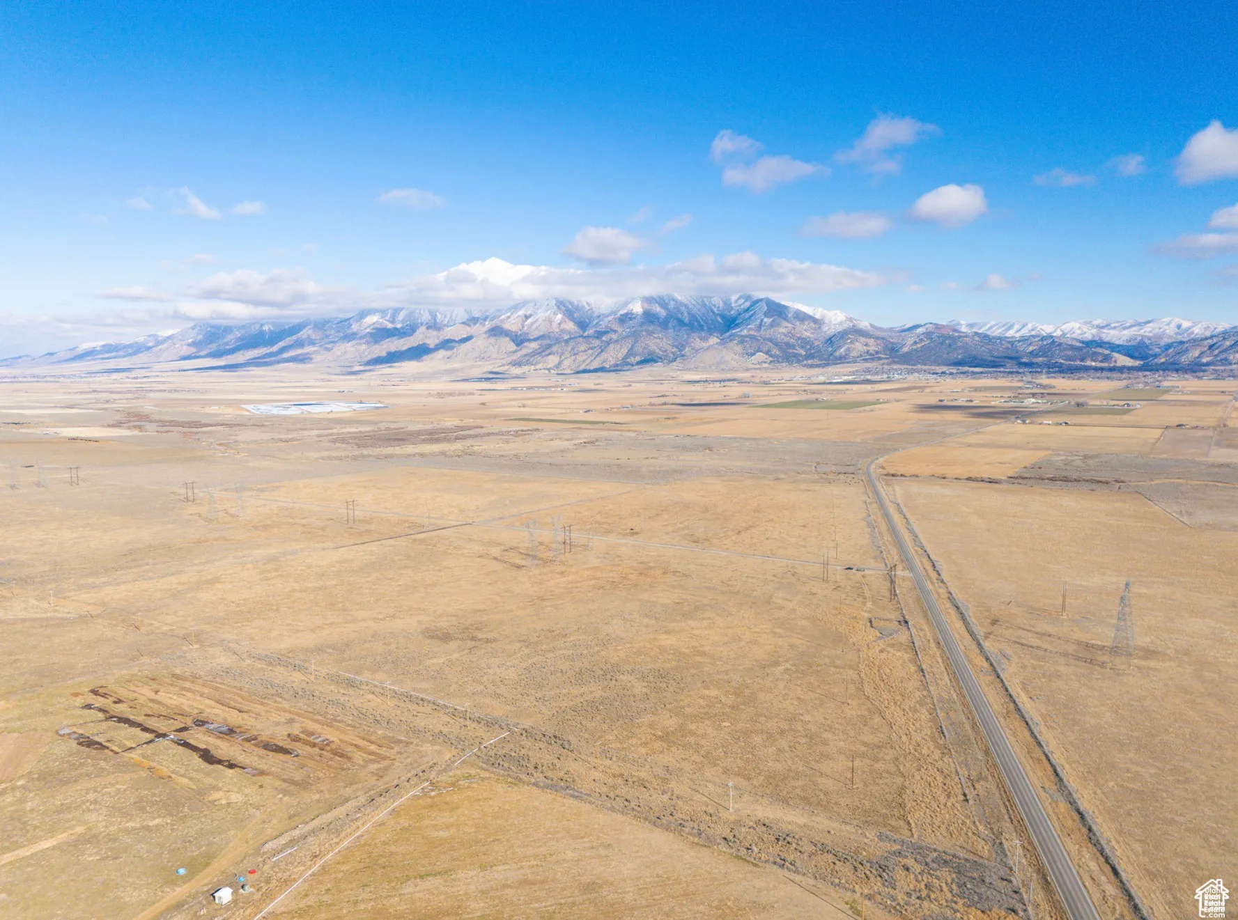 Aerial view of sparsely populated area with a mountain backdrop