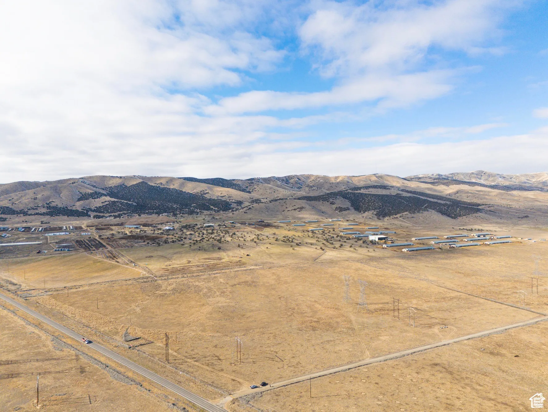 View of mountain backdrop featuring rural landscape