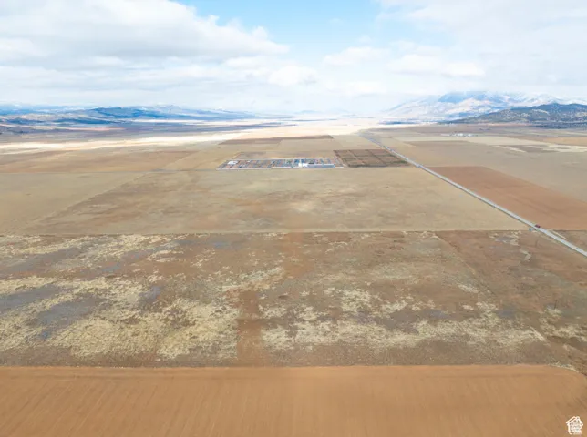 Aerial view of sparsely populated area featuring a mountain backdrop