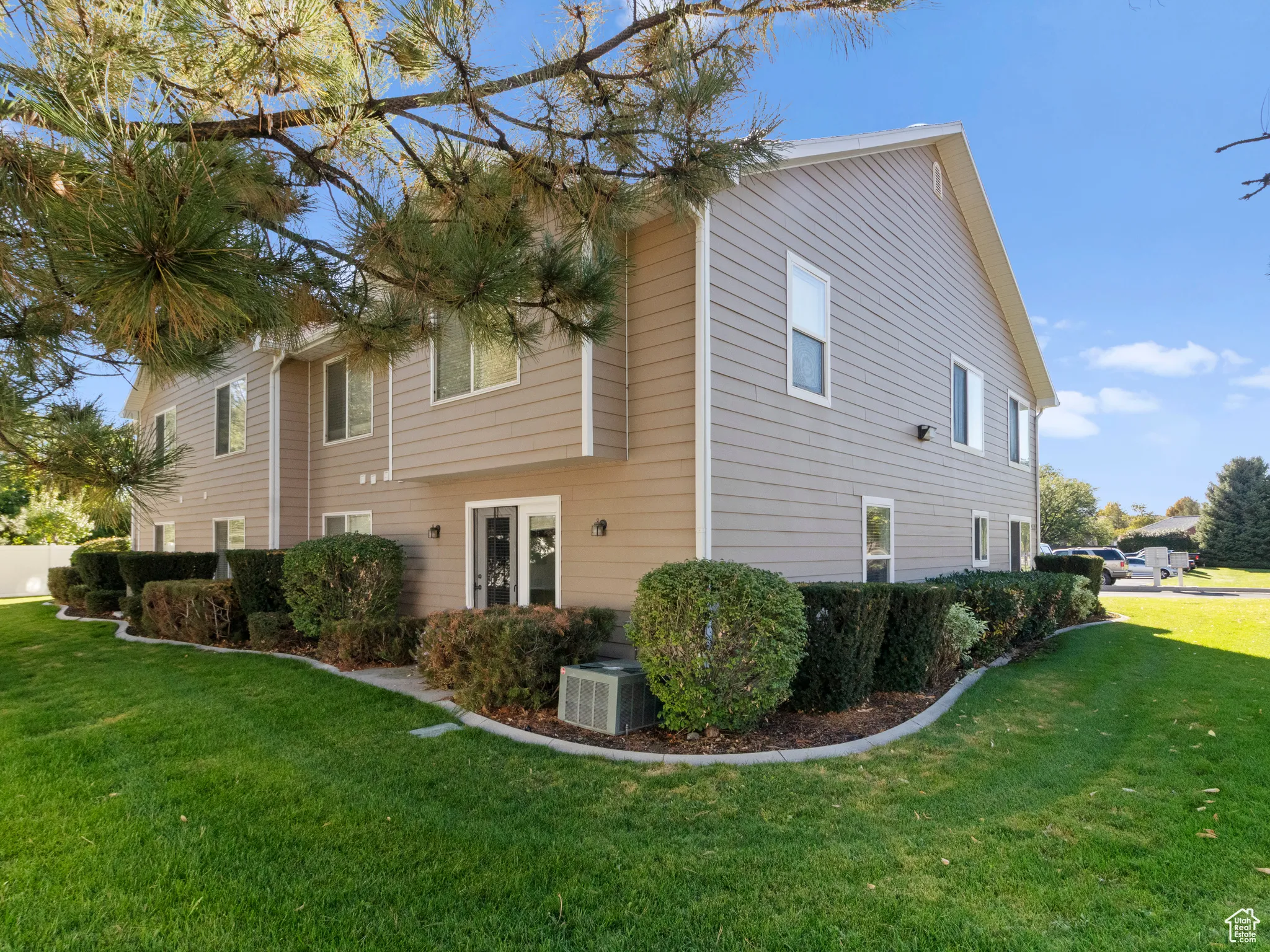 Rear view of house featuring a yard
