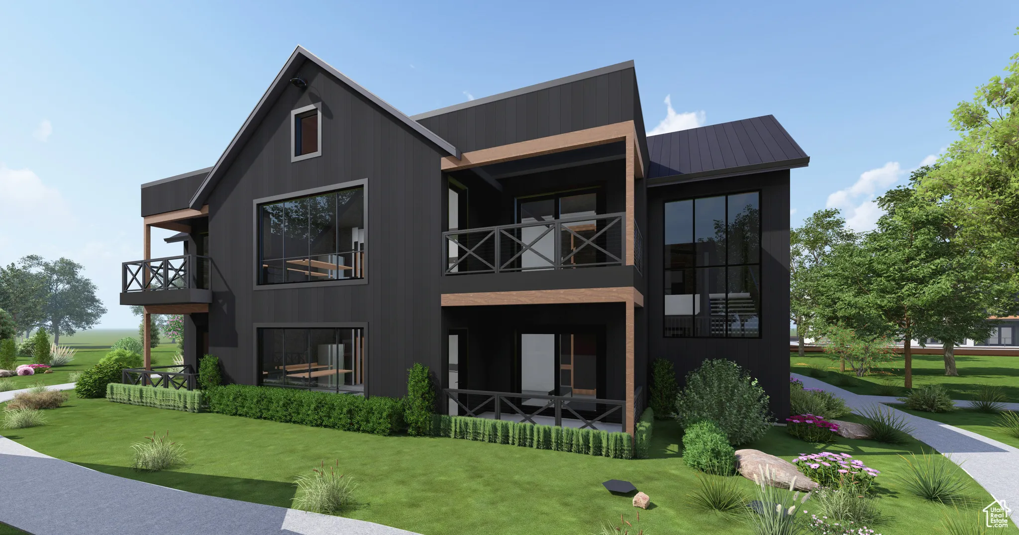 Back of house with a metal roof, a balcony, a lawn, and a patio