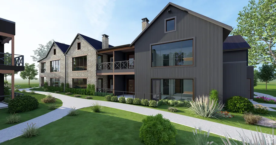 View of property's community featuring a lawn and a balcony