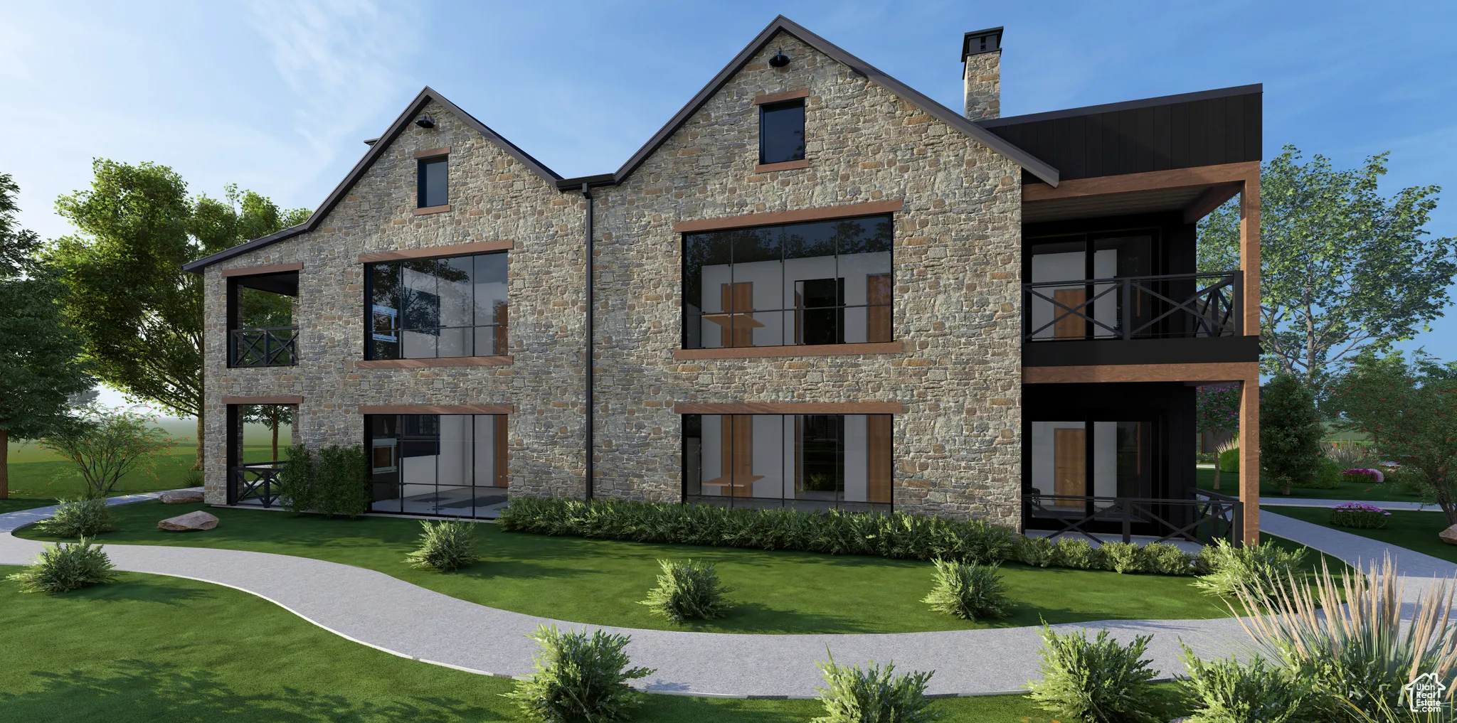 Rear view of house featuring a balcony, a yard, stone siding, and a chimney