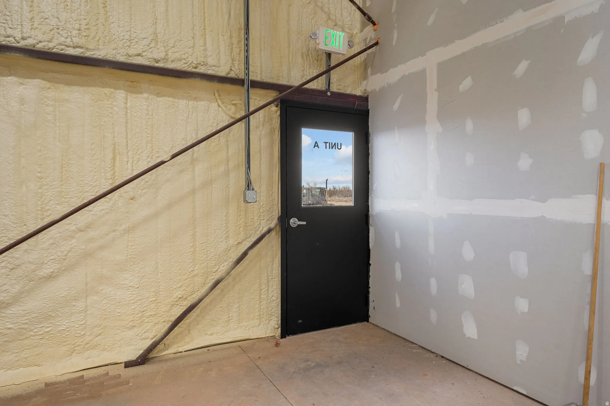 Doorway to outside with concrete floors